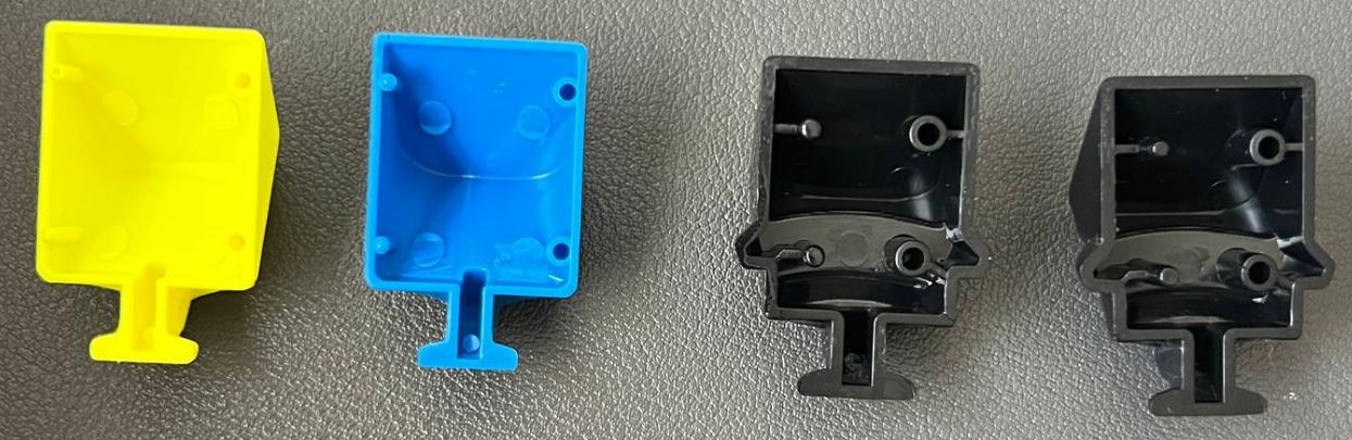 Comparison photo of four injection-molded plastic parts in yellow, blue, and black, showing part geometry and draft details used in the manufacturability analysis.